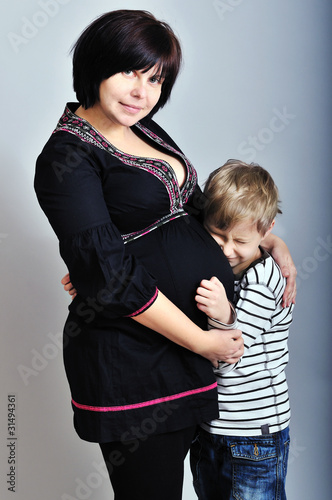 Photo: pregnant mother with older son pregnant mother with older son
