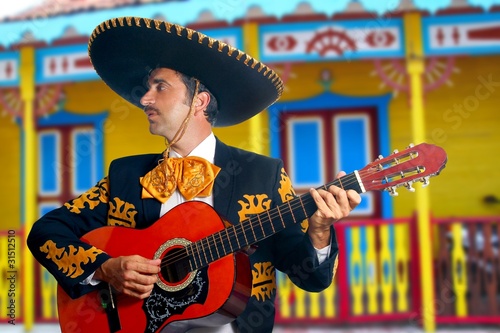 Photo: Charro Mariachi playing guitar Mexico houses Charro Mariachi playing guitar Mexico houses