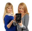 Two girls with retro photographic camera.