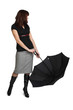 Young woman is holding black umbrella.