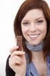 happy young beautiful woman with a bar of chocolate