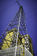 High Voltage Pylon In Front Of Two Houses, Urban Scene High Voltage Pylon In Front Of Two Houses, Urban Scene