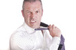 Angry frustrated stressed businessman pulls his tie off whilst m