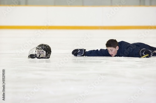 Photo: Hockey Player Who Has Fallen On The Ice Hockey Player Who Has Fallen On The Ice