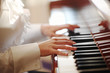 Photo: Female hands playing piano. Closeup, shallow DOF. Female hands playing piano. Closeup, shallow DOF.