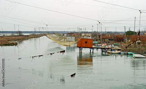 Photo: Italy Ravenna canal fishing net Italy Ravenna canal fishing net