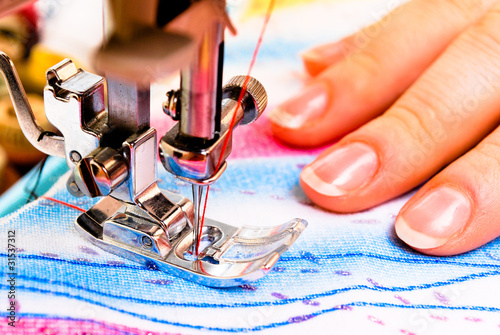 Photo: Hand sewing on a machine Hand sewing on a machine