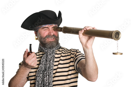 Photo: Pirate looks through a telescope Pirate looks through a telescope