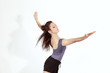 Young pretty teenage girl brunette dancing