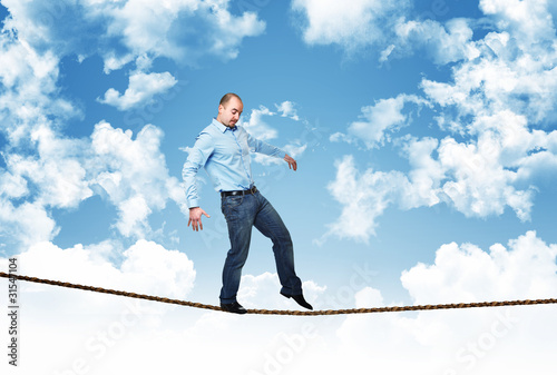 Photo: man walk on rope man walk on rope