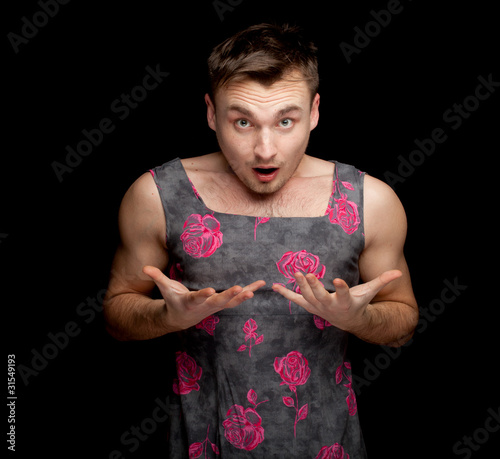 Photo: frightened man dressed as woman, black baskground frightened man dressed as woman, black baskground