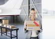 Supervisor holding box in hangar