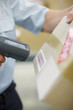 Close up of worker scanning box