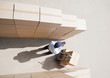 Foto: worker standing with boxes and hand truck worker standing with boxes and hand truck
