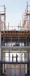Construction workers shaking hands on construction site