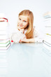 Photo: smiling girl with books in library smiling girl with books in library