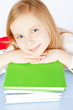 Photo: smiling small girl with books on table smiling small girl with books on table