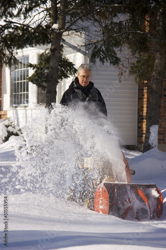 Photo: Man Using Snow Blower Man Using Snow Blower