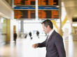 Businessman checking watch in airport