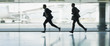 Businessmen running in airport