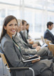Business people attending seminar in office