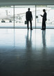 Businessmen standing in airport