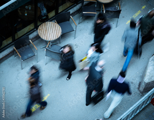 Photo: people walking in the city seen from above people walking in the city seen from above