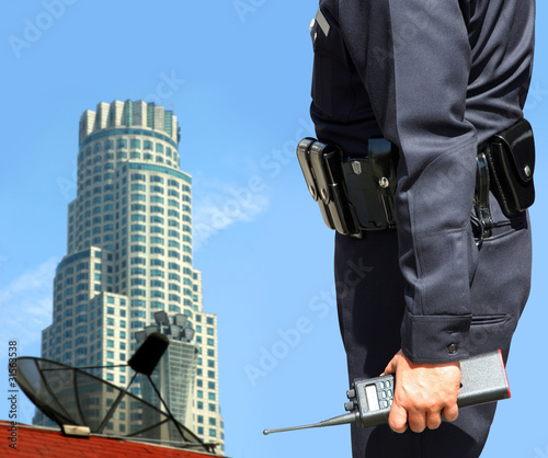 Photo: Security agent watching downtown area Security agent watching downtown area