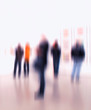A motion blurred image of people at an exhibition A motion blurred image of people at an exhibition