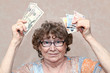 senior happy woman with money