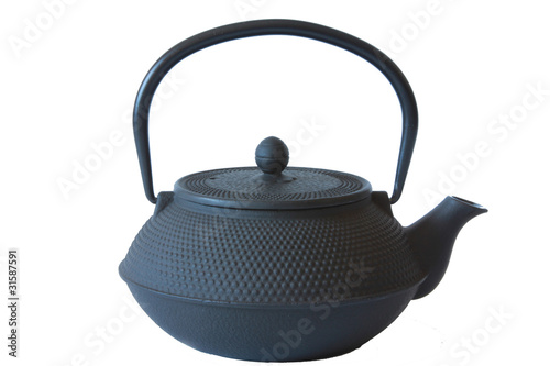 Photo: Cast iron kettle for tea on a white background Cast iron kettle for tea on a white background