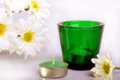 Simple white daisies and two candles with isolated white backgro