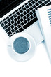 Cappuccino cup on laptop. Above view Cappuccino cup on laptop. Above view