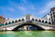 Venice Grand canal with gondolas and Rialto Bridge, Italy