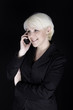 Attractive business woman talking on mobile phone