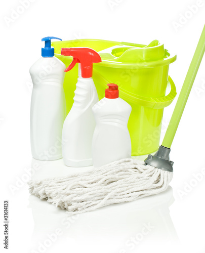 Photo: bottles on a background of the bucket and mop bottles on a background of the bucket and mop
