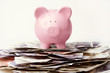 Piggy bank on stack of British Pounds