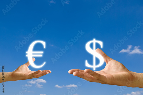 Photo: Small hand exchange the Euro icon with the Dollar icon Small hand exchange the Euro icon with the Dollar icon