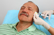 Photo: Men receiving botox injection Men receiving botox injection