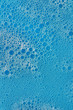 Soap bubbles macro with blue background