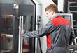 worker at machining tool workshop