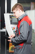 Photo: worker at machining tool workshop worker at machining tool workshop