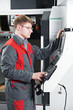 worker at machining tool workshop