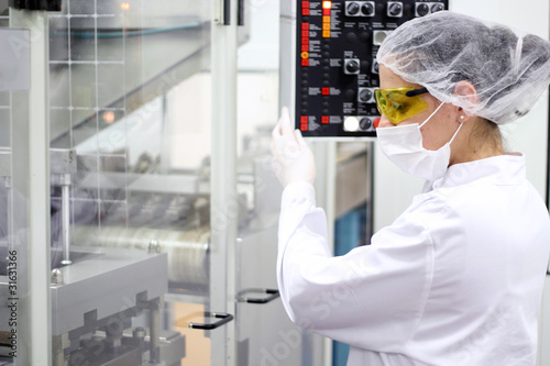 Photo: Young Women Operating The Control Panel Young Women Operating The Control Panel