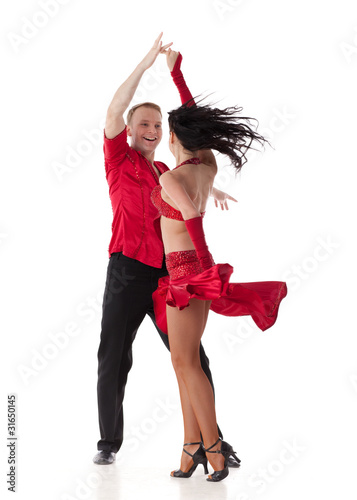 Photo: Dancing young couple. Dancing young couple.