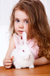 Girl and a white rabbit