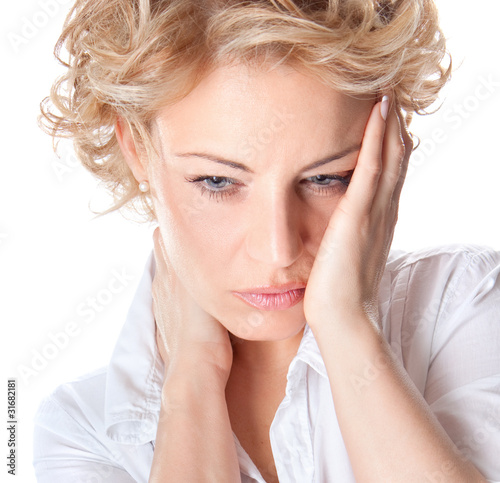 Photo: Woman with pain in her neck Woman with pain in her neck