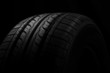Car tire on black background