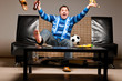 soccer fan on sofa