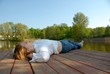 Foto: woman relaxing at a lake woman relaxing at a lake